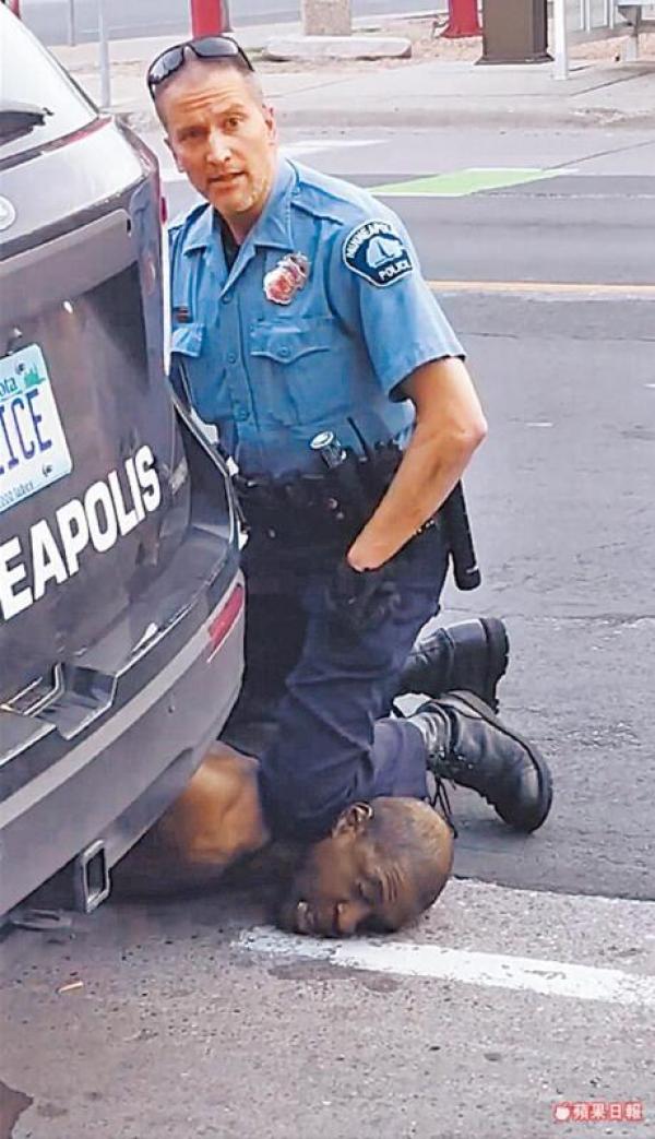 20200601-white policeman and black guy.jpg
