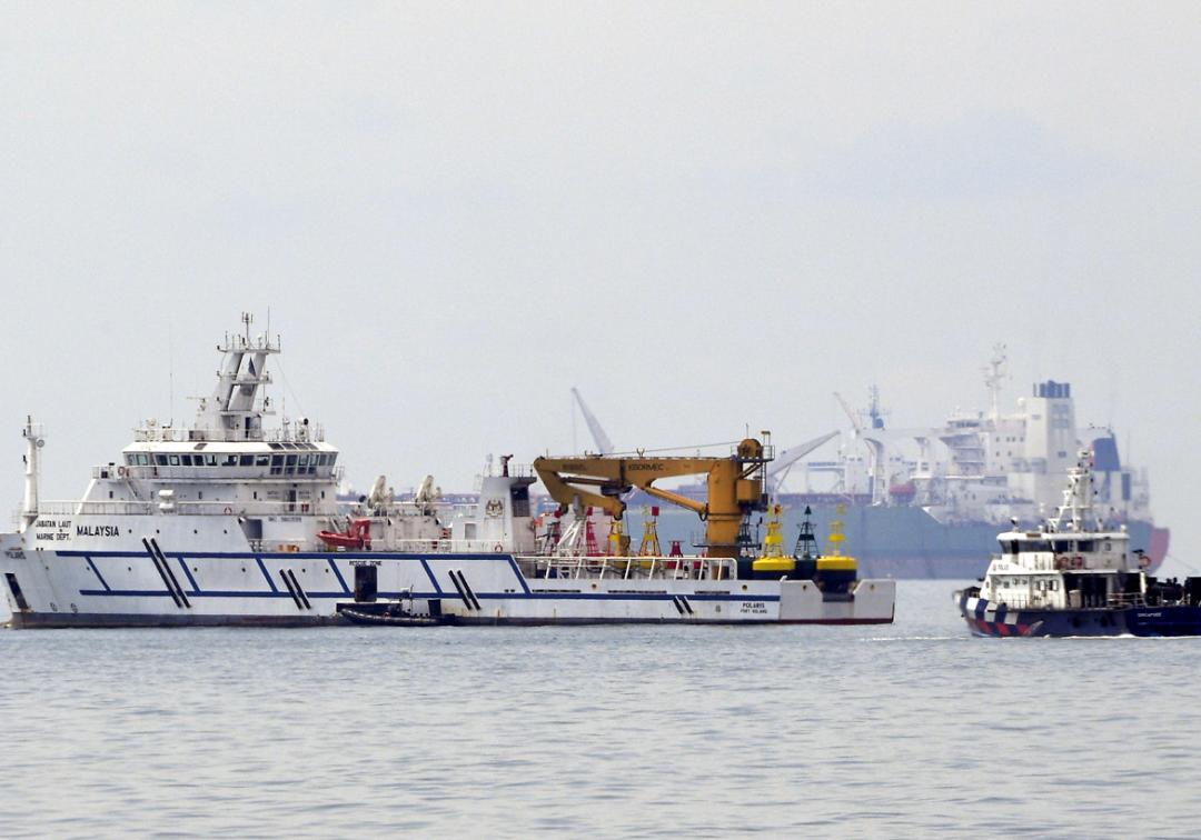 st_A Malaysian government vessel, the Polaris (left), near a Singapore Police Coast Guard vessel (right) in the waters off the Tuas View Extension.jpg