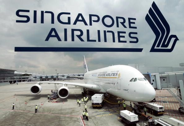 SINGAPORE, SINGAPORE: This file photo taken on the 11 November 2005, shows a prototype Airbus A380 parked at the Singapore Changi Airport terminal during its first long-range test flight outside europe. Airbus will display the world's largest commercial aircraft, the A380, in Singapore Airlines (SIA) colours at the Asian Aerospace show here next month, the carrier said. AFP PHOTO/ROSLAN RAHMAN (Photo credit should read ROSLAN RAHMAN/AFP/Getty Images)